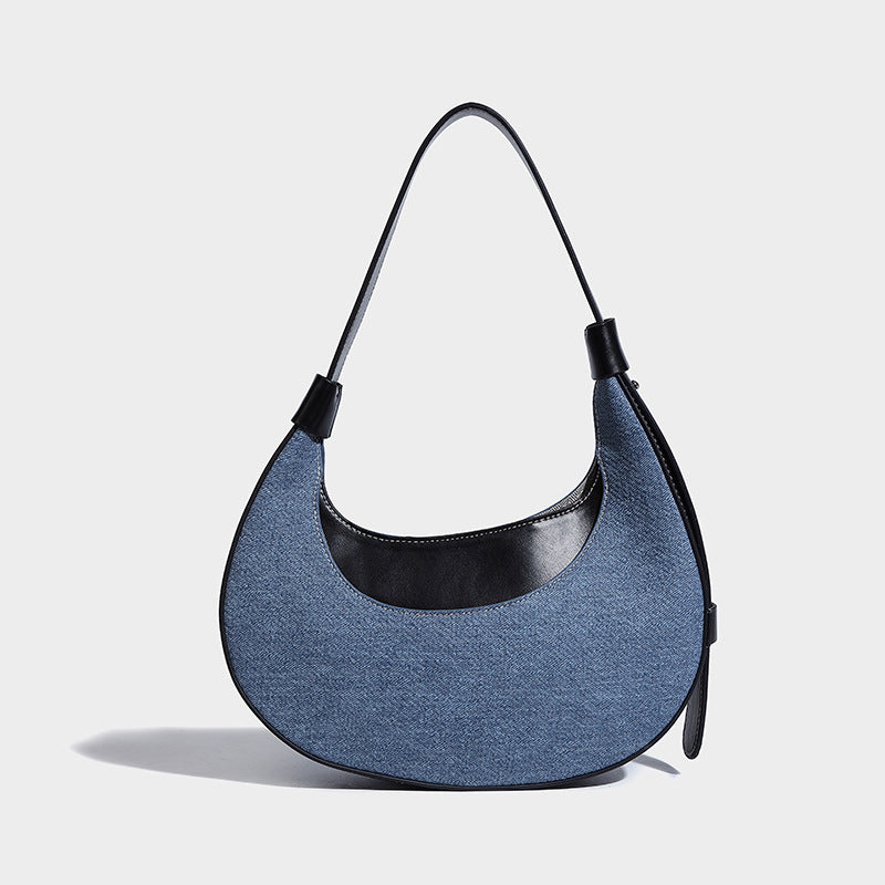 Bolsode media luna. Diseño moderno, minimalista y elegante, ideal para llevar al hombro en un look casual chic. Perfecto para el día a día