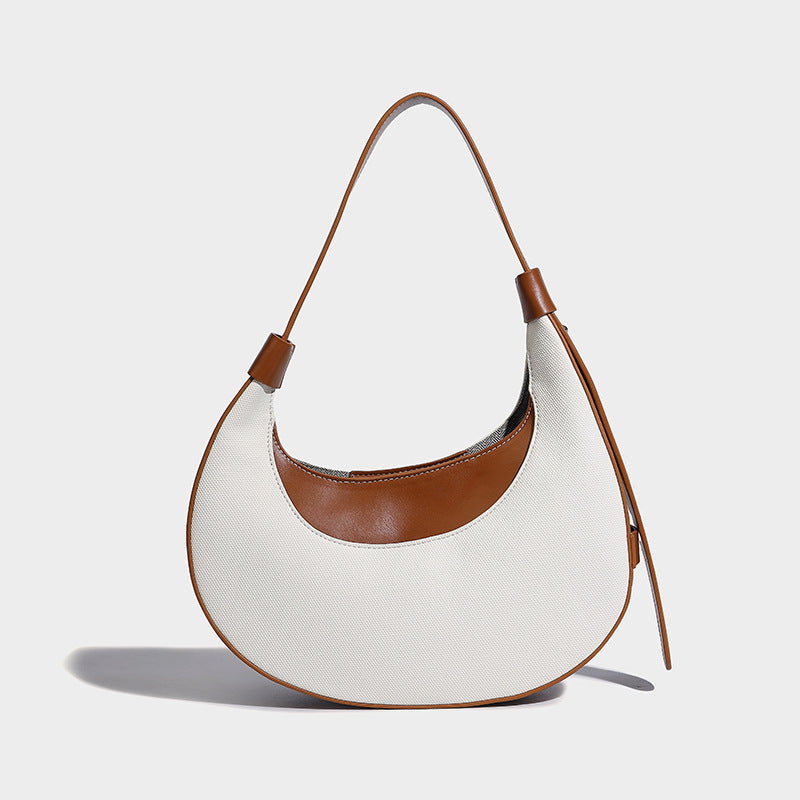 Bolsode media luna. Diseño moderno, minimalista y elegante, ideal para llevar al hombro en un look casual chic. Perfecto para el día a día