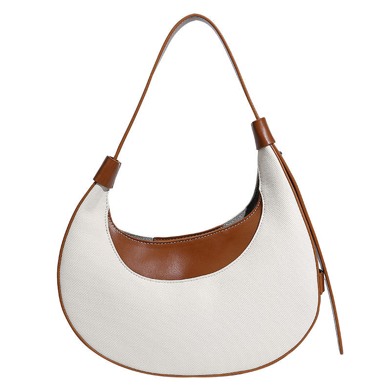 Bolsode media luna. Diseño moderno, minimalista y elegante, ideal para llevar al hombro en un look casual chic. Perfecto para el día a día