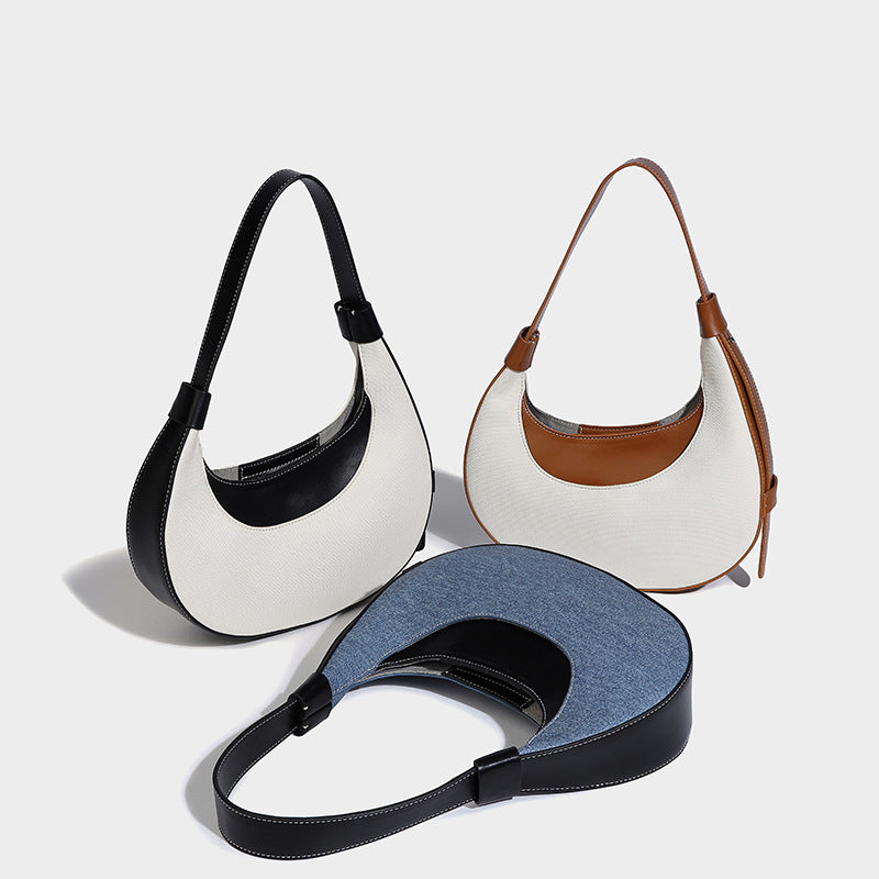 Bolsode media luna. Diseño moderno, minimalista y elegante, ideal para llevar al hombro en un look casual chic. Perfecto para el día a día