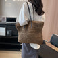Bolso de paja con asas de cuero
