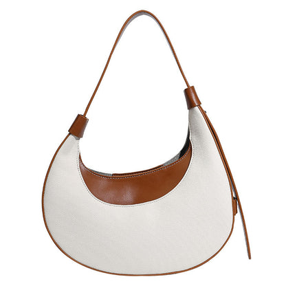 Bolsode media luna. Diseño moderno, minimalista y elegante, ideal para llevar al hombro en un look casual chic. Perfecto para el día a día