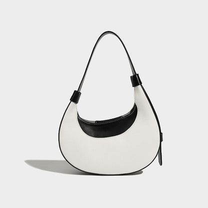 Bolsode media luna. Diseño moderno, minimalista y elegante, ideal para llevar al hombro en un look casual chic. Perfecto para el día a día